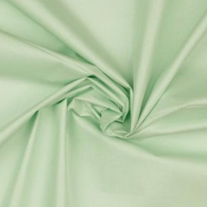 Katoen stof met foliedruk, licht groen. Q799