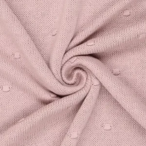Gebreide stof, stippen, poederroze. Y477