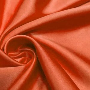 Stretch satijn stof,  terra/oranje brieck. ST456